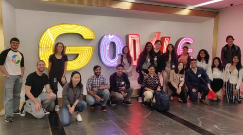 students in front of google sign