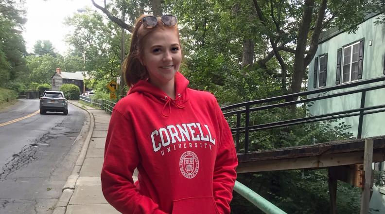 Macy Nicol wearing a red Cornell sweatshirt.
