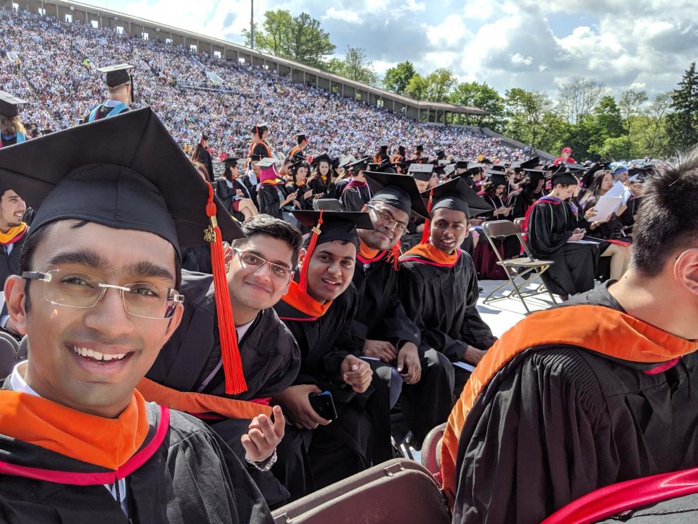 students sitting in the stadium during commencement 